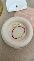 Pulsera de hilo rojo